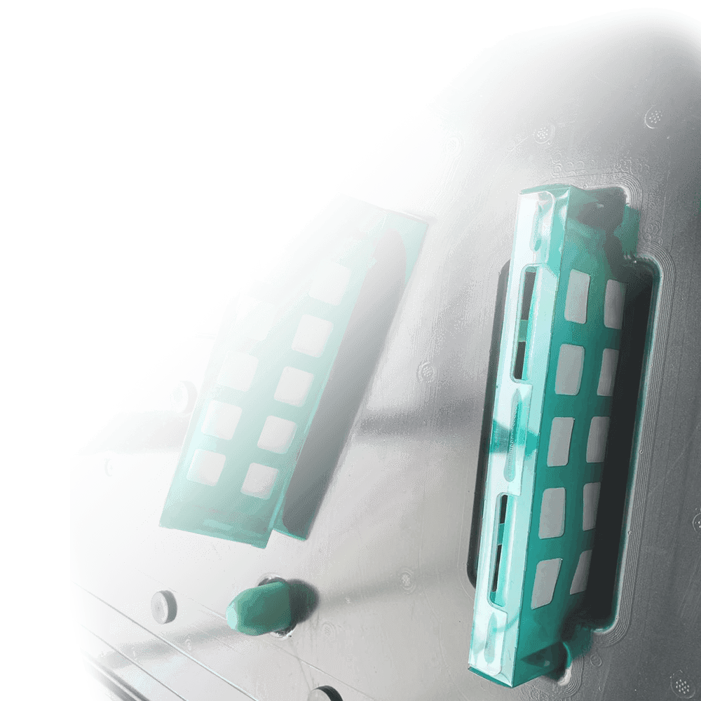 Large size GreenVCI Emitters in a black electronics tray used to inhibit corrosion.
